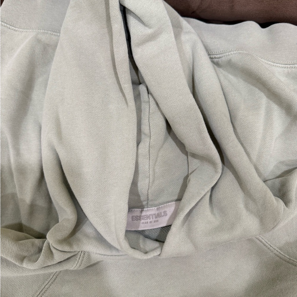 Fear of God Essentials Hoodie in Light Sage Green